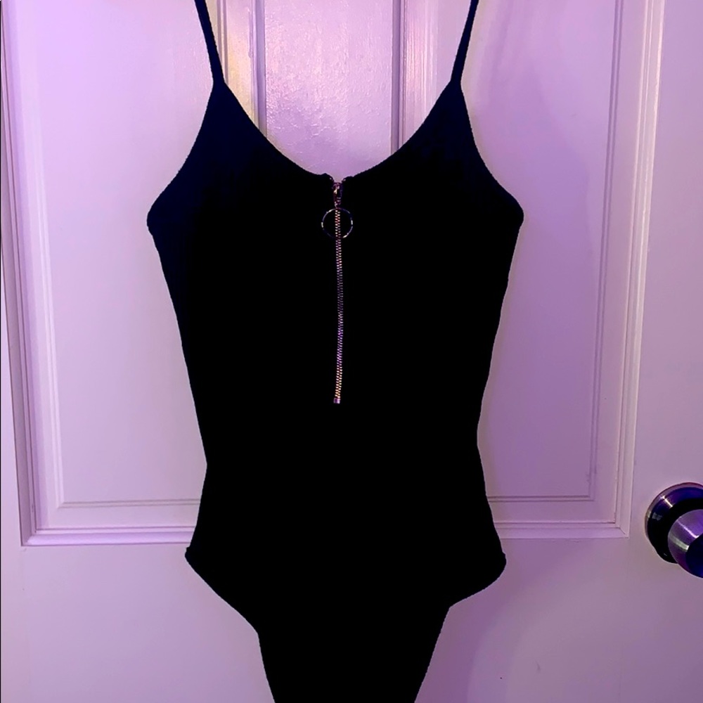 Cute black bodysuit with the gold zipper